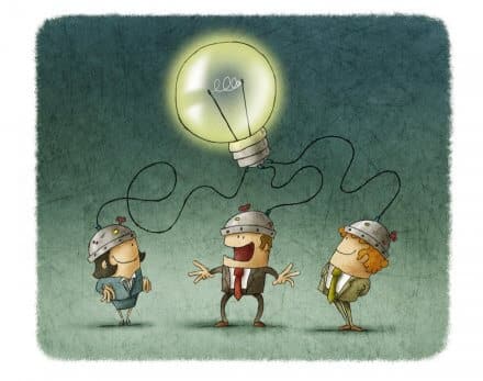 Three people with brains connected to a large illuminated bulb - metaphor for engagement